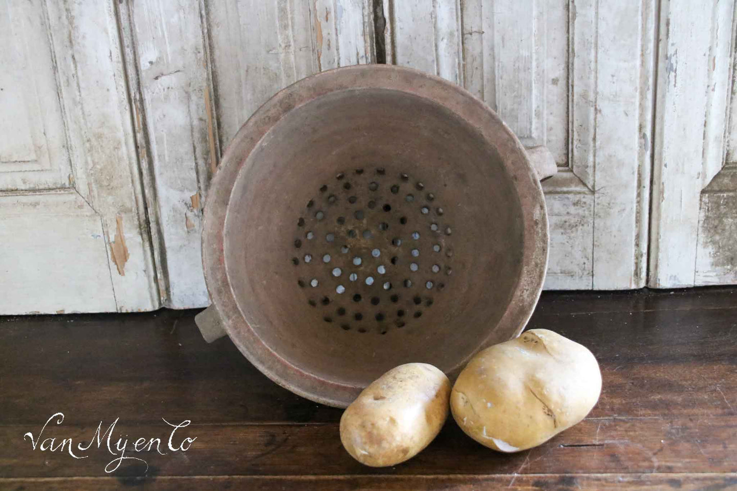 Antique earthenware colander