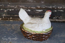 Load image into Gallery viewer, Porcelain chicken on nest in color.
